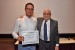 Dr. Nagib Callaos, General Chair, giving Prof. Jorge E. Salamanca Céspedes the best paper award certificate of the session "Sistemas, Cibernética e Informática II." The title of the awarded paper is "Educación en Energías Renovables no Convencionales “EERNC”, para la Adaptación Tecnológica de Energía Eólica ."